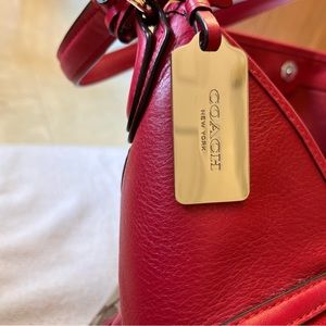 Red and tan coach purse